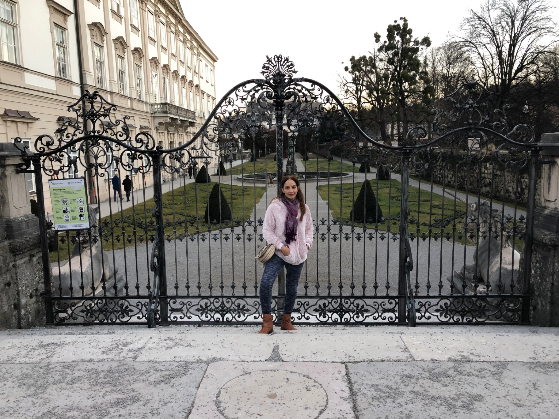 Cathy in front of ornate palace gates
